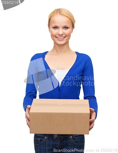 Image of smiling woman in casual clothes with parcel box