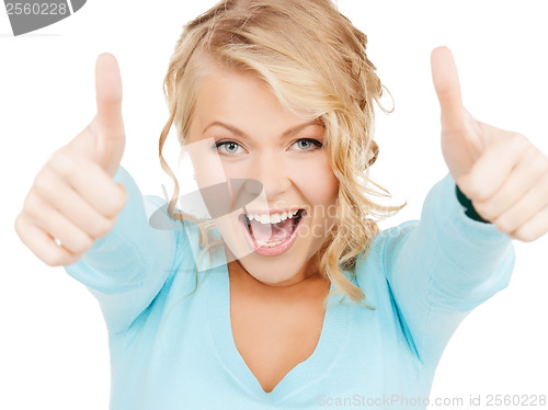 Image of young businesswoman with thumbs up