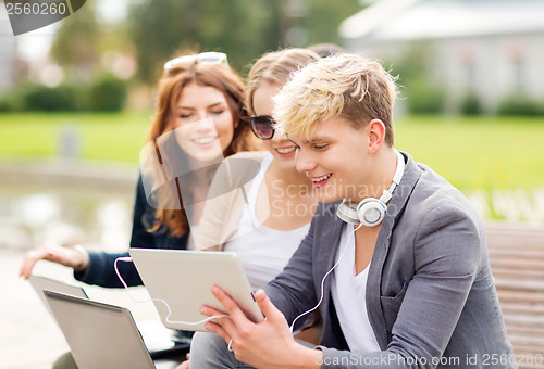 Image of students or teenagers with laptop computers