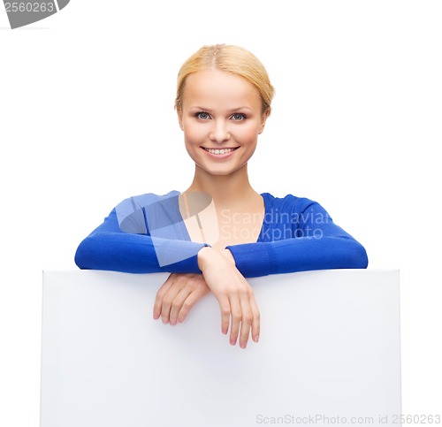 Image of woman in casual clothes with blank white board