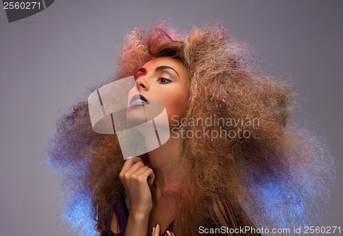 Image of woman with long curly hair