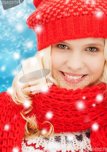 Image of teenage girl in red hat and scarf