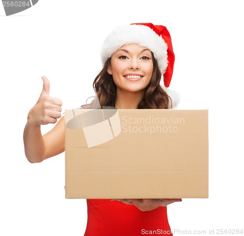 Image of smiling woman in santa helper hat with parcel box