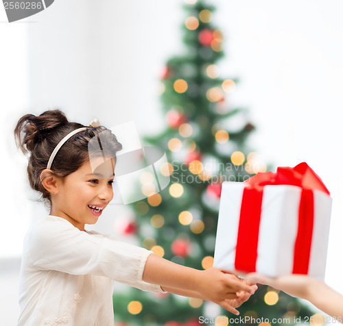 Image of happy child girl with gift box