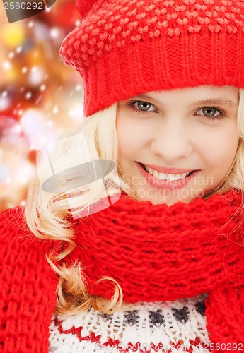Image of teenage girl in red hat and scarf