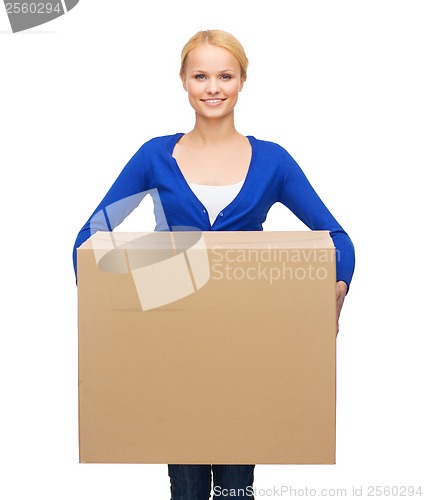 Image of smiling woman in casual clothes with parcel box