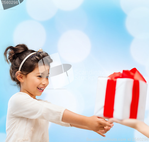 Image of happy child girl with gift box