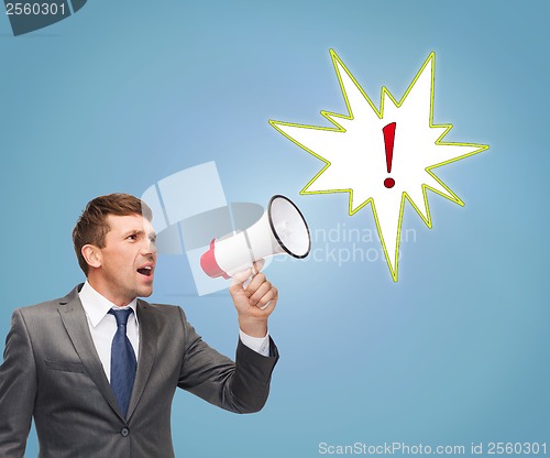 Image of buisnessman with bullhorn or megaphone