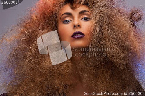 Image of woman with long curly hair