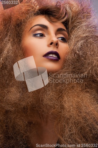 Image of woman with long curly hair