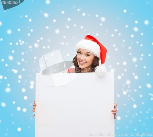 Image of woman in santa helper hat with blank white board