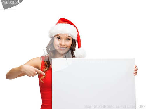 Image of woman in santa helper hat with blank white board