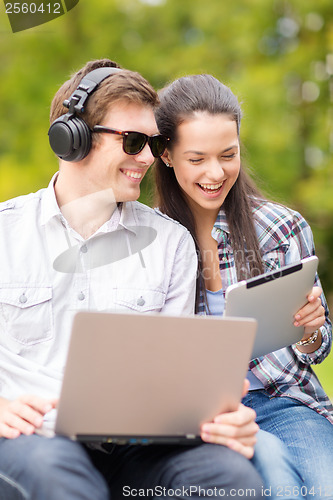 Image of students or teenagers with laptop computers