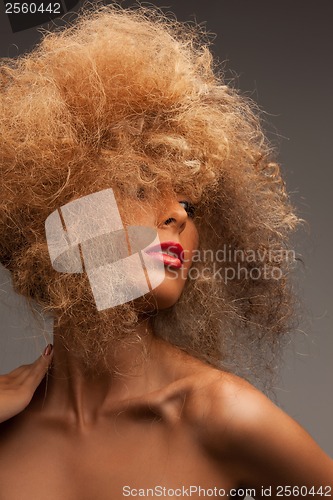 Image of woman with long curly hair