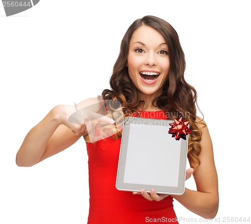 Image of smiling woman in red dress with tablet pc