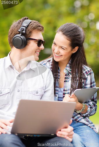 Image of students or teenagers with laptop computers