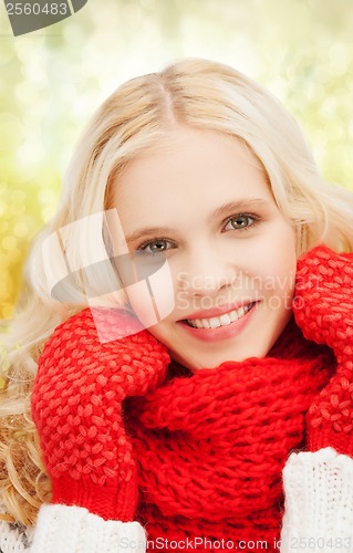 Image of teenage girl in red mittens and scarf
