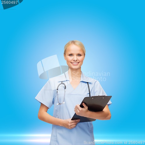 Image of female doctor or nurse in mask holding syringe