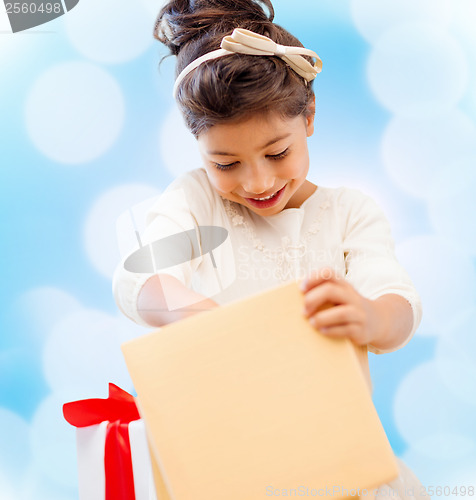 Image of happy child girl with gift box