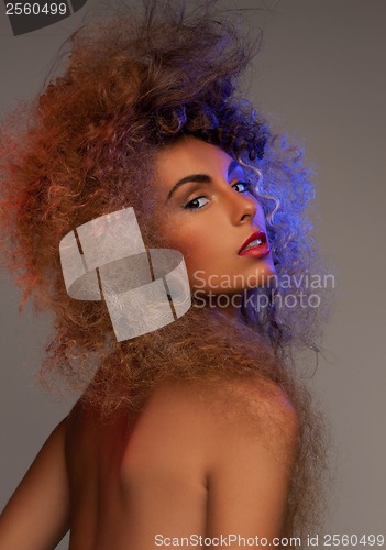 Image of woman with long curly hair