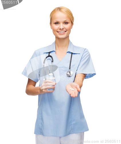 Image of smiling doctor or nurse offering pills and water