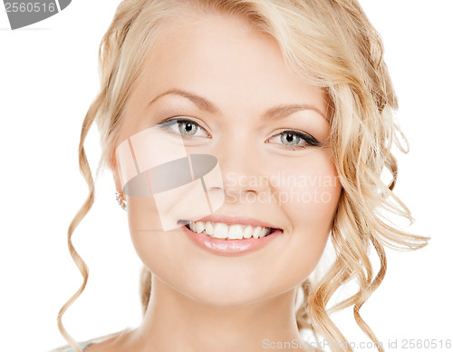 Image of face of happy woman with long hair