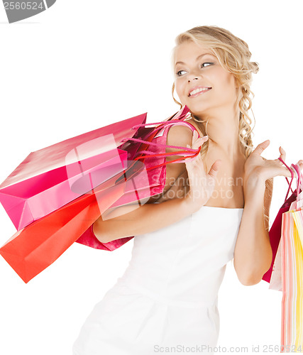 Image of picture of happy woman with shopping bags