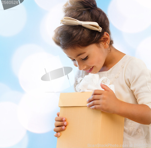 Image of happy child girl with gift box