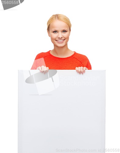 Image of smiling woman in sweater with blank white board