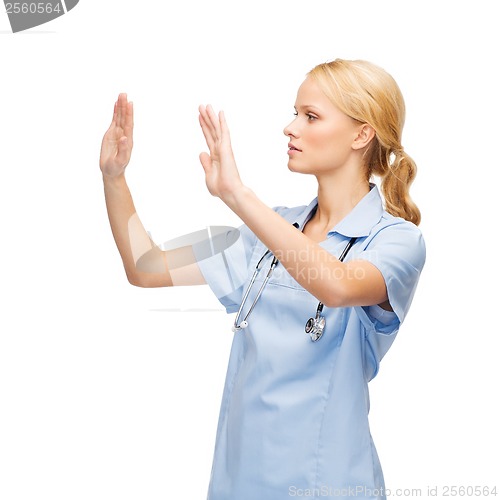 Image of doctor or nurse working with virtual screen