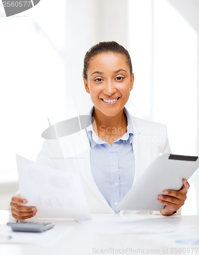 Image of businesswoman with tablet pc in office