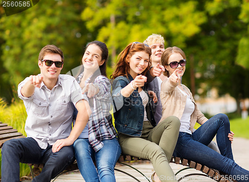 Image of group of students or teenagers pointing fingers