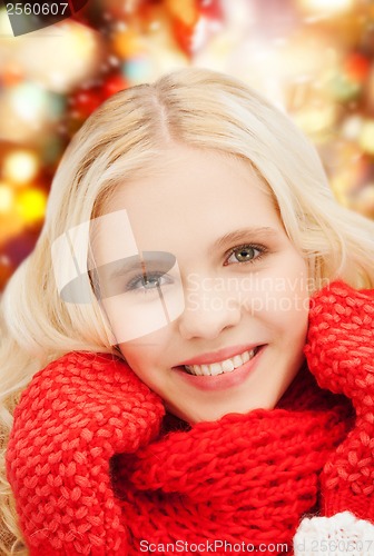 Image of smiling teenage girl in red mittens and scarf