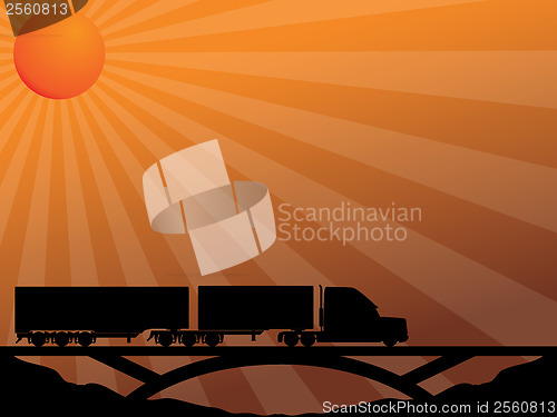 Image of Truck on bridge passing in the sunset