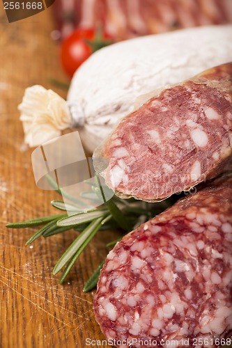 Image of Smoked sausage with rosemary and peppercorns tomatoes and garlic