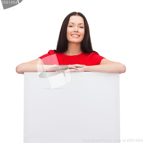 Image of smiling young woman with blank white board
