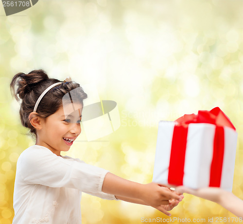 Image of happy child girl with gift box