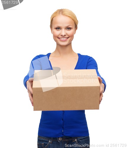 Image of smiling woman in casual clothes with parcel box