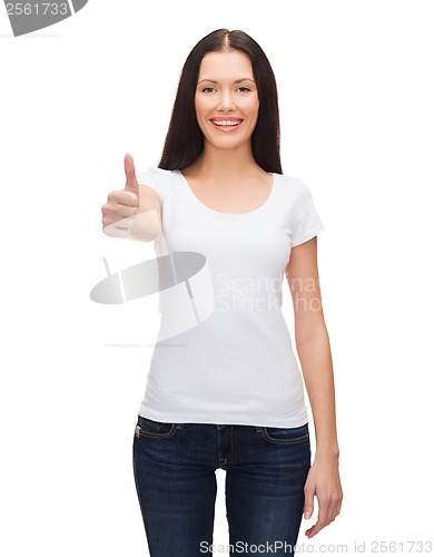 Image of smiling woman in white t-shirt showing thumbs up