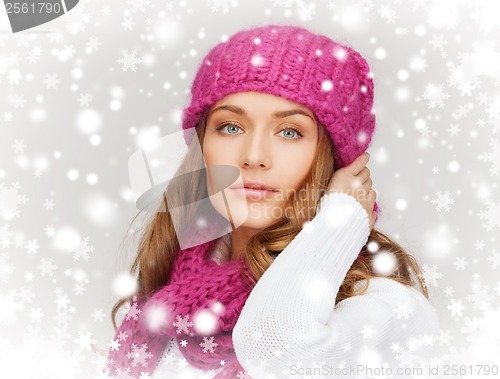 Image of woman in pink hat and scarf