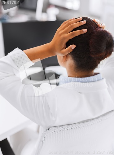 Image of stressed woman with computer