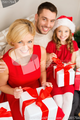 Image of happy family opening gift boxes