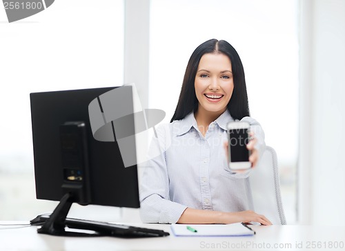 Image of smiling businesswoman or student with smartphone