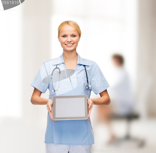 Image of smiling female doctor or nurse with tablet pc