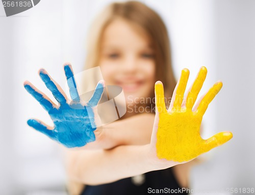 Image of girl showing painted hands