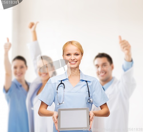 Image of smiling female doctor or nurse with tablet pc