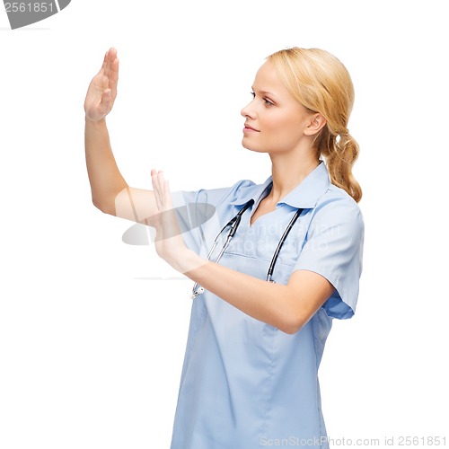 Image of doctor or nurse working with virtual screen