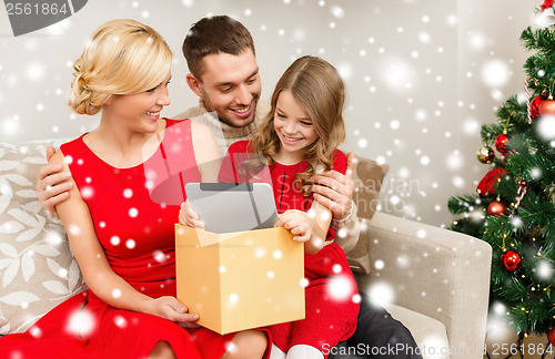 Image of smiling family with tablet pc