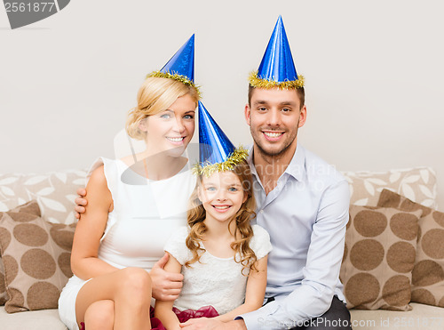 Image of happy family in hats celebrating