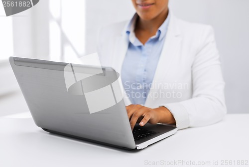 Image of businesswoman using her laptop computer